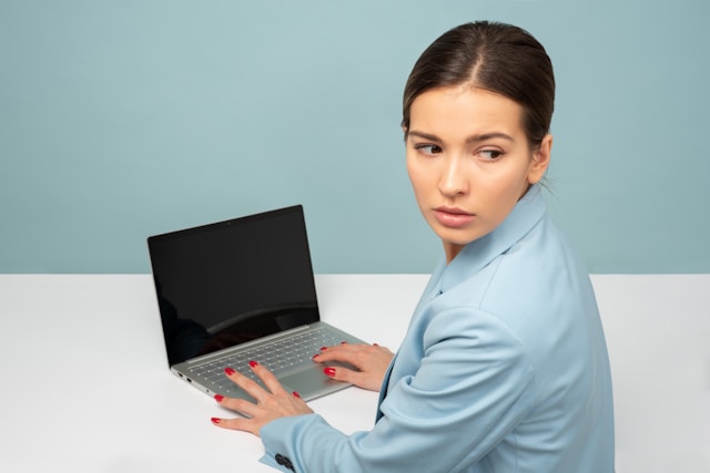 Cyberattack-Downtime-Impact-on-SMBs Stressed employee looking at crashed business systems
